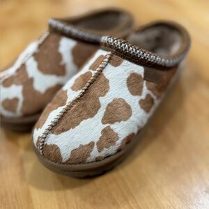 UGG Tan and Cream Tasman cow print Fuzzy Slip-Ons